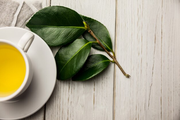 Cup of herbal tea on table