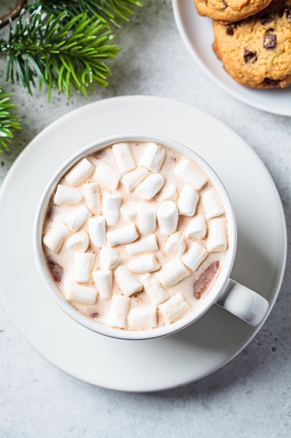 Cup of hot chocolate or cocoa with marshmallow Festive background