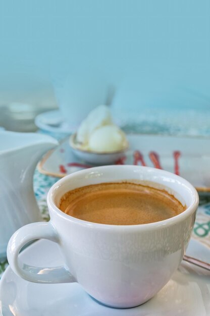 Cup of hot coffee on table in cafe bar