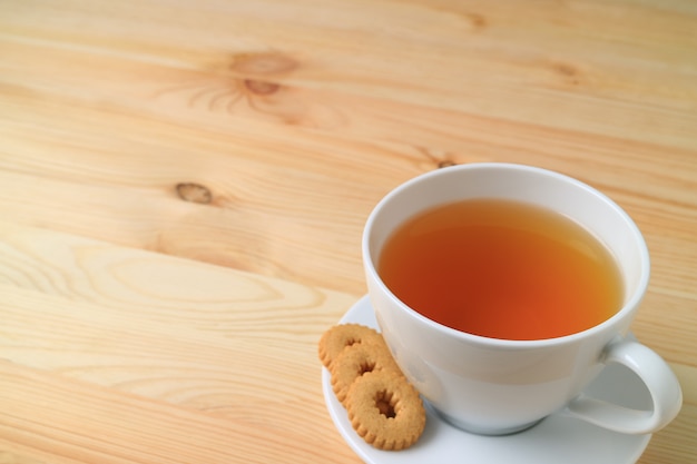 Cup of Hot tea and Cookies Served on Natural Wooden Table