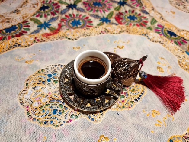 Photo a cup of hot turkish coffee style on the table