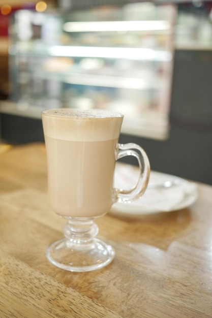 A cup of late coffee on cafe table