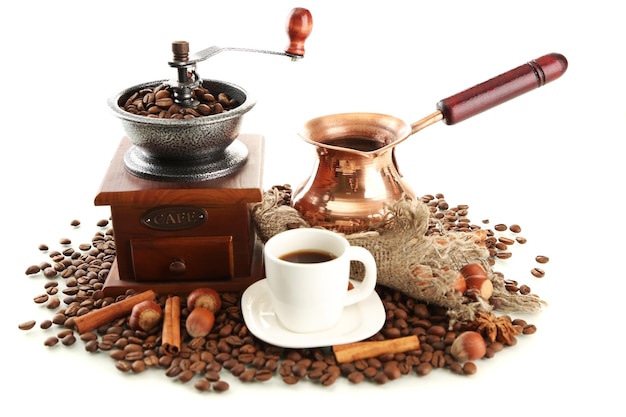 Cup and pot of coffee and coffee beans isolated on white