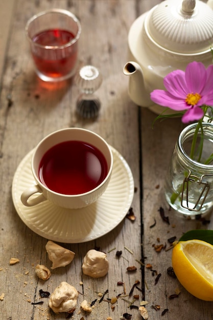 Cup of red tea on table