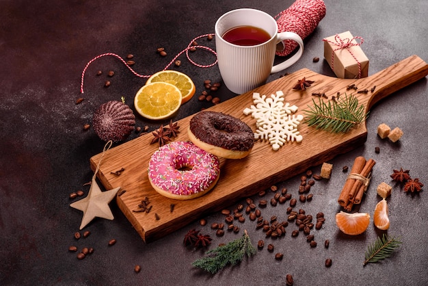 A cup of strong coffee on the Christmas table with spruce twigs and toys. Preparing for the holiday