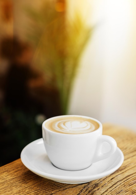 A cup of tasty and fresh cappuccino on the table