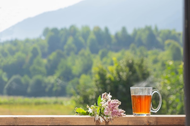 cup of tea on background mountains in sunlight