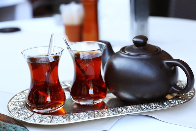 Cup of tea and cake on a table in cafe