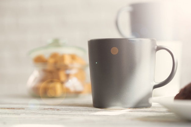 Cup of tea or coffee on modern kitchen 