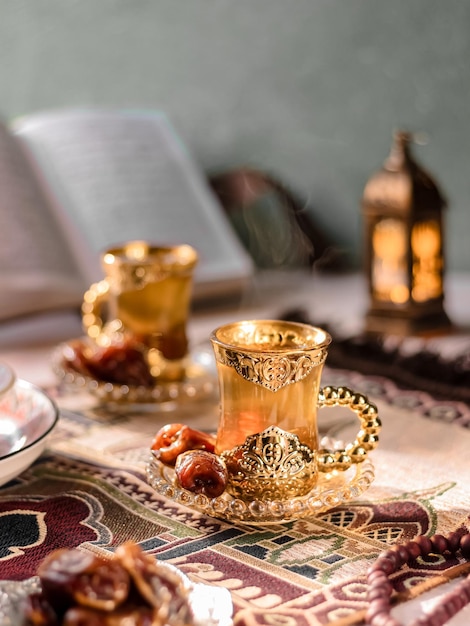 A cup of tea served with dates fruits. Middle East Vibe Concept