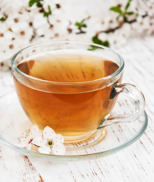 Cup of tea and spring blossom