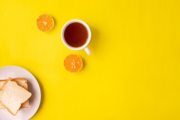 Cup of tea on yellow background