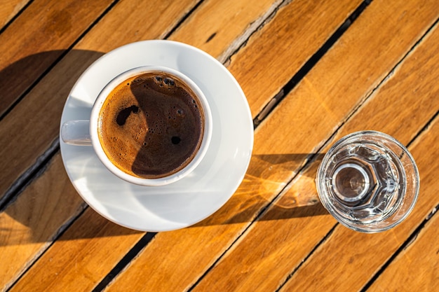 Cup of Turkish coffee in cafe Wooden background Top view