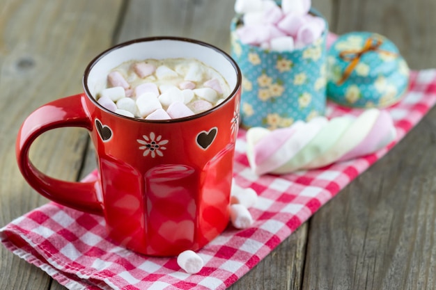 Cup with hot drink with marshmallows