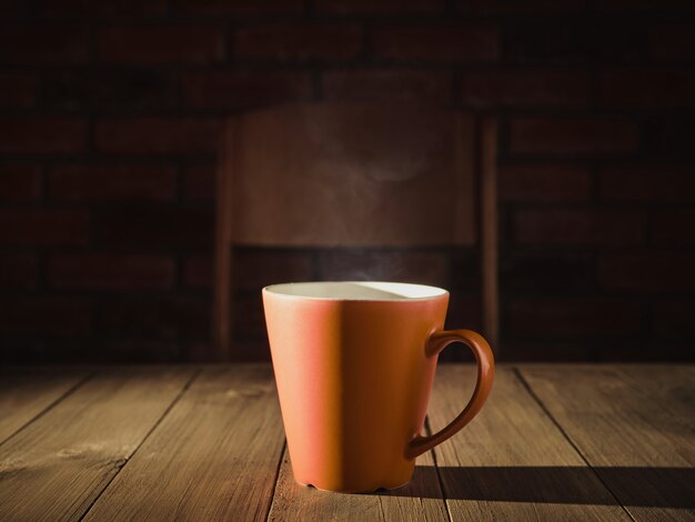 Cup with hot tea on the table