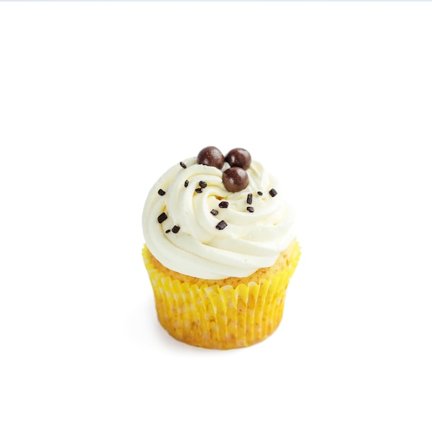 Cupcake with delicate cream and candy on a white background The concept of food desserts holiday