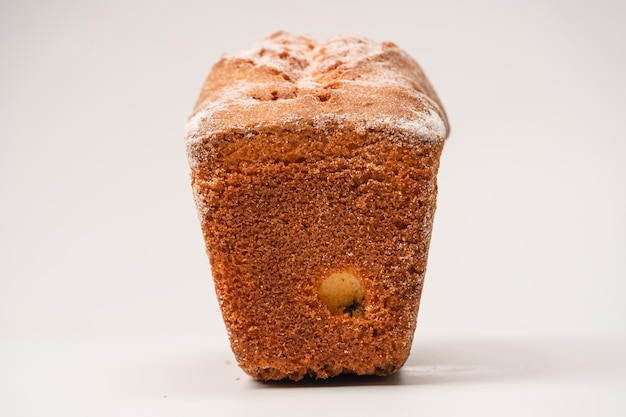 A cupcake with raisins isoalted on a white background