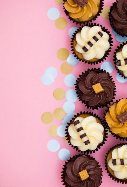 Cupcakes decorated with chocolatecaramel and vanilla icing