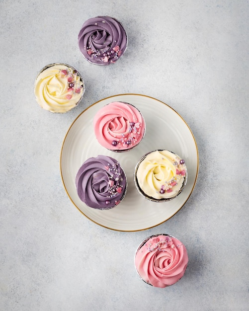 Cupcakes with cream on top view Desserts for a gift in a box