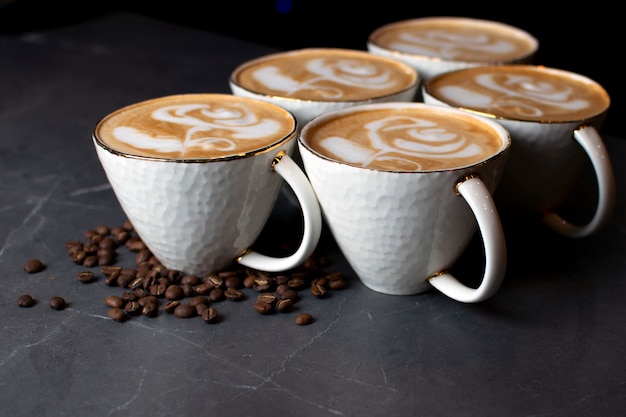 Cups of coffee on a marble table