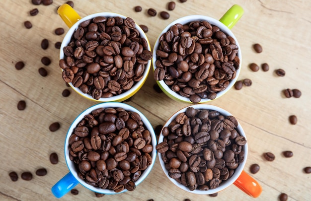 Cups full of coffee beans