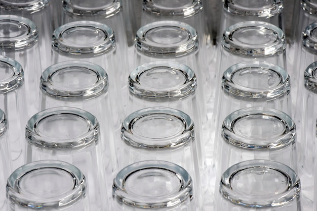 Cups lined up in cupboard of popular restaurant