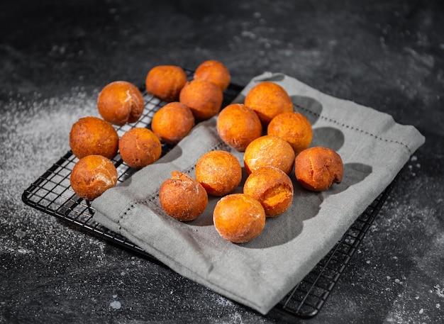 curd balls on a napkin on a dark background