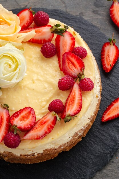 curd cheesecake decorated with berries and roses