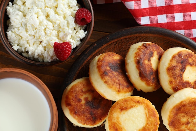 Curd fritters on a plate in the village Traditional delicious food