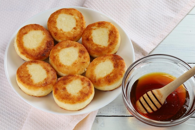 Curd fritters with honey Hearty and healthy breakfast Traditional food