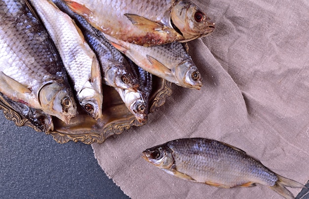 Cured fish carp on an iron plate