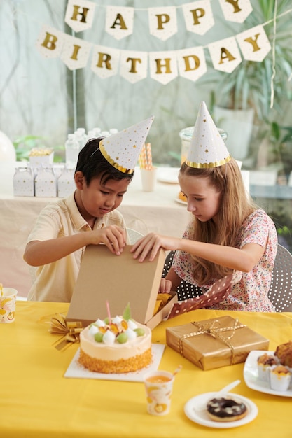 Curious Kids Opening Birthday Presents