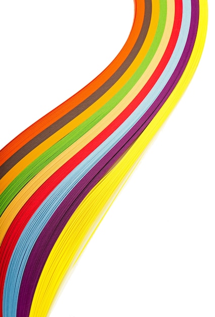 Curl rainbow strip paper on white surface