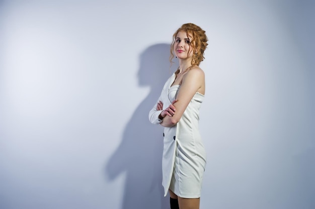 Curly hair girl isolated on white studio background