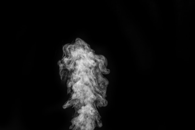 Curly white steam, Fog or smoke isolated transparent special effect on black background. Abstract mist or smog background, design element for your image, Layout for collages.