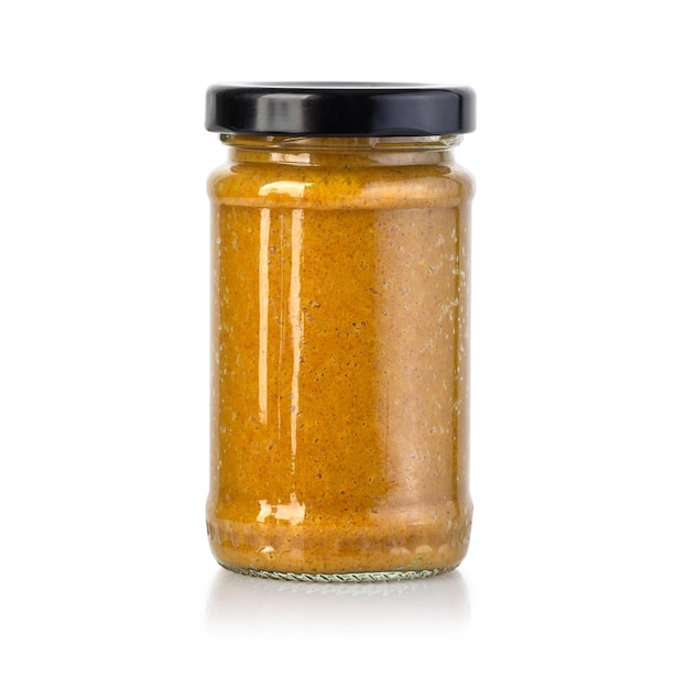 Curry paste in glass jar isolated on white background with clipping path