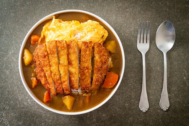 curry rice with tonkatsu fried pork cutlet and creamy omelet - Japanese food style