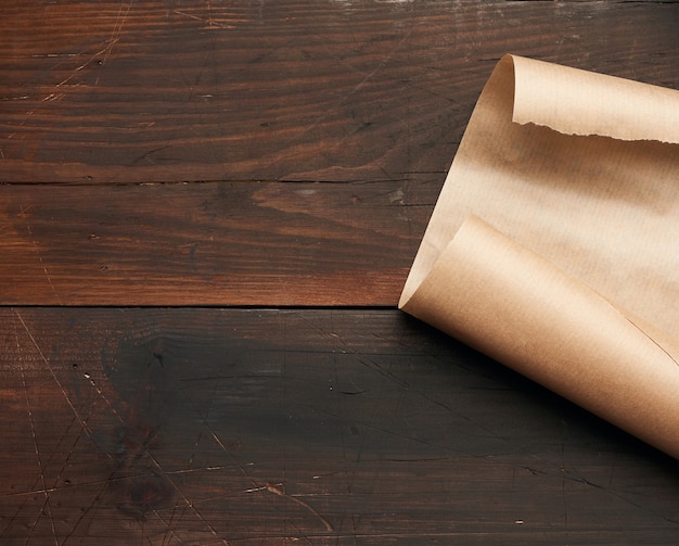 Curved edge of a brown parchment paper sheet