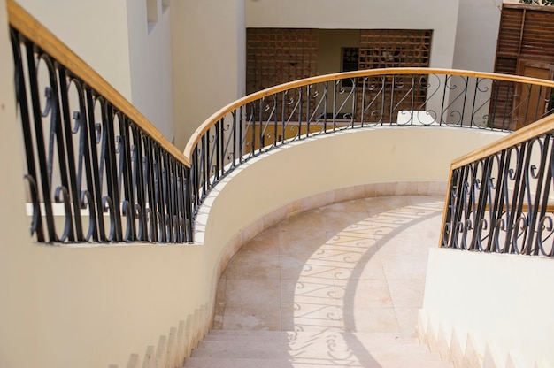 Curved stairway in luxury shopping mall.