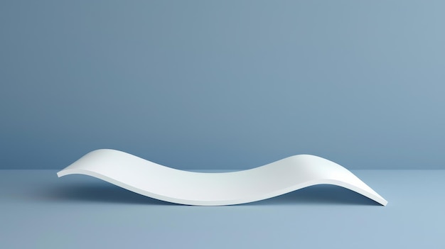 Photo a curved white object on a blue surface