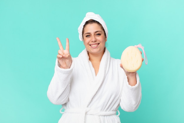 Curvy pretty woman after a shower wearing bathrobe