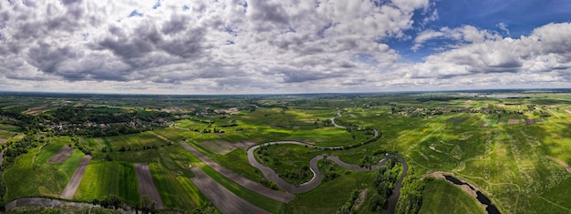 Photo curvy river nida and farmlands drone panorama polish countryside