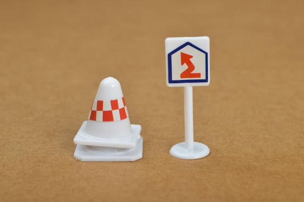 Curvy road warning sign and plastic cones