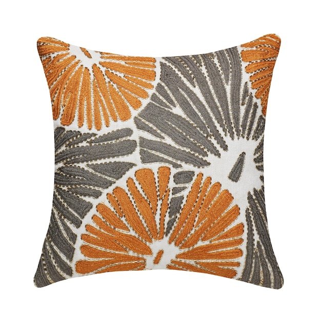 A cushion with a leaf pattern on it.