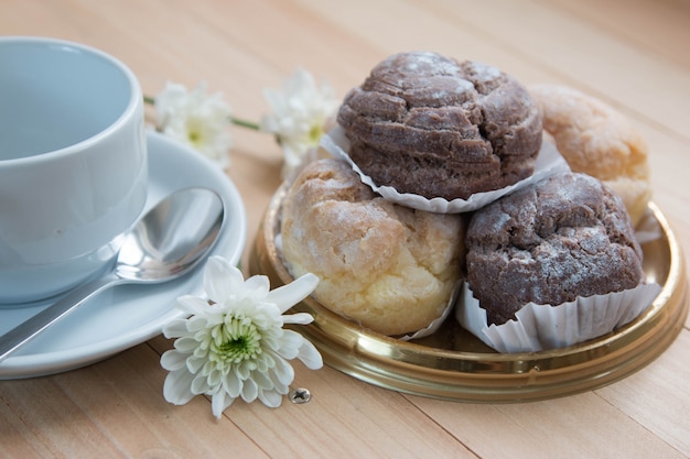 Custard and chocolate Chu cream puff on plate