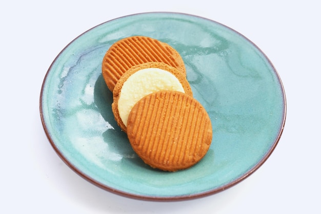 Custard cream sandwich biscuits on white background