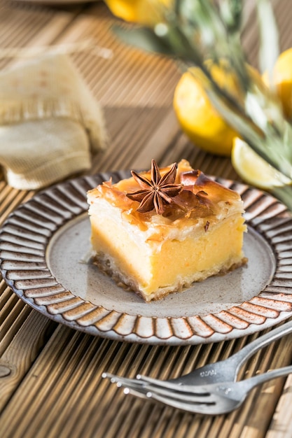 Custard of Galaktoboureko or bougatsa Greek traditional dessert baked in a pan with syrup its called Thessaloniki pie Handmade phyllo stuffed with sweet semolina cream