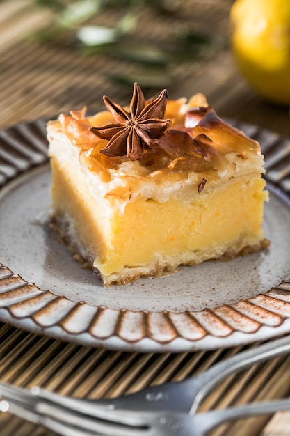 Custard of Galaktoboureko or bougatsa Greek traditional dessert baked in a pan with syrup its called Thessaloniki pie Handmade phyllo stuffed with sweet semolina cream