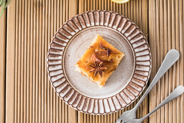 Custard of Galaktoboureko or bougatsa Greek traditional dessert baked in a pan with syrup its called Thessaloniki pie Handmade phyllo stuffed with sweet semolina cream