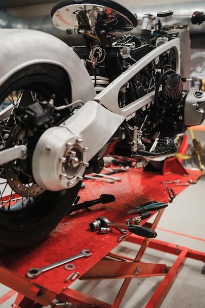 Custom motorcycle standing in repair shop